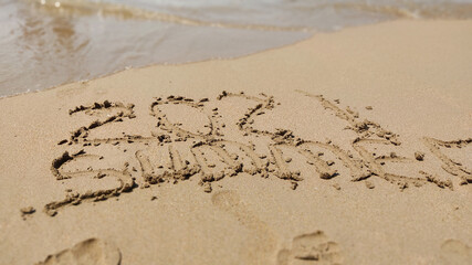 handmade written  Summer 2021 on the sea beach