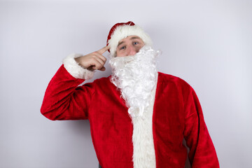 Fototapeta na wymiar Man dressed as Santa Claus standing over isolated white background having an idea.