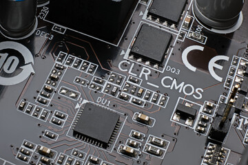 Smd chip pwm microcontroller on brown motherboard with a lot of surface mount components resistors,...