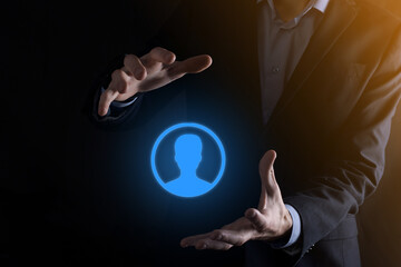 Businessman in suit holding out hand icon of user. Internet icons interface foreground. global network media concept,contact on virtual screens ,copy space