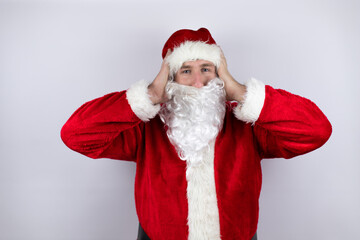 Man dressed as Santa Claus standing over isolated white background thinking looking tired and bored with hands on head