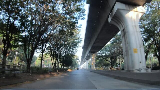 Driving through the streets of the city with morning traffic at Pune India.
