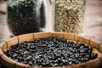 
Freshly roasted coffee beans by using a pan in a basket for packing.