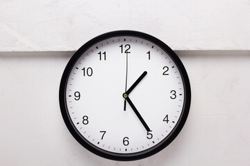 wall clock at white old painted background