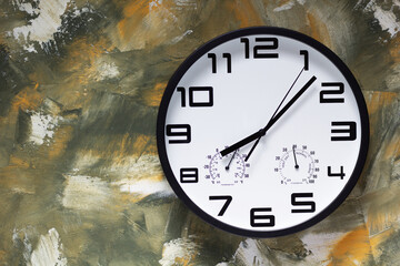 wall clock at colorful paintes texture