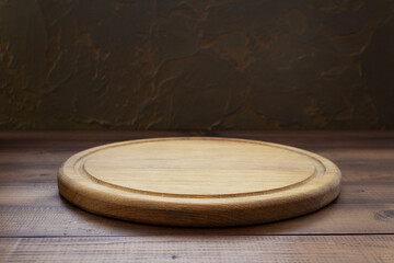 wooden cutting board on table background
