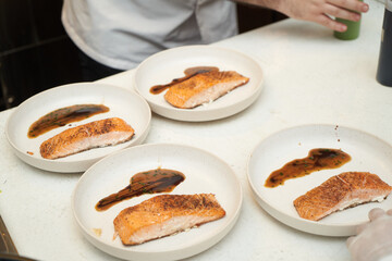 The Cook cooking fish. Chef Prepares fish