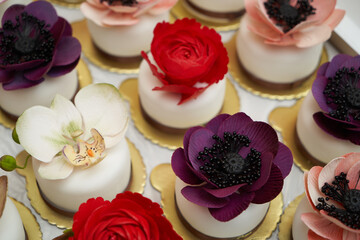 Flower cakes background. Birthday cupcakes with flowers.