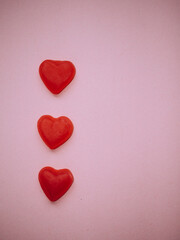 Gummy hearts with pink background. Valentine concept. Copy space