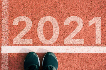 Men in sports uniform running around. A healthy way of life, and infused figure. sneakers close-up, finish in 2020. Start to the new year 2021 plans, goals, objectives