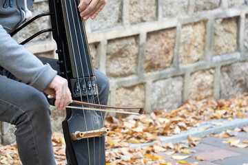 a street-playing electronic cello player