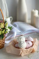Fototapeta na wymiar Homemade white and pink zephyr in a basket