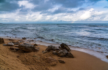 Storming sea in cloudy weather