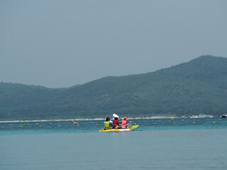 Someone kayaking to the sea