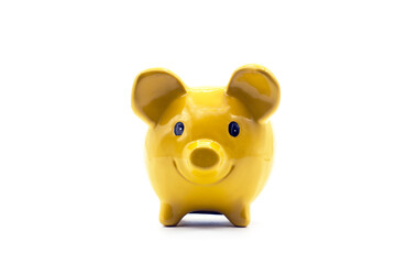 Closeup of yellow piggy bank on white background
