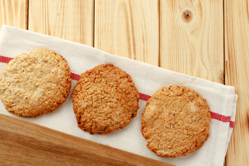 Oat cookies on wooden table close up