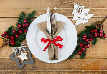Christmas table setting on wood background, flat lay