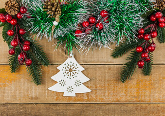 Photo of wooden table with Christmas decoration. Top view.