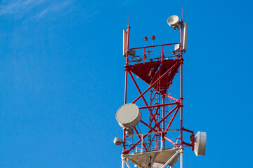 A cell phone tower 4G 5G. Internet connection with a blue sky on the background