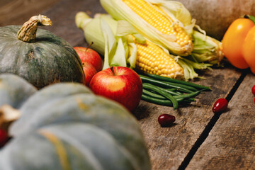 Close up of vegetables pumpkins and corn cobs
