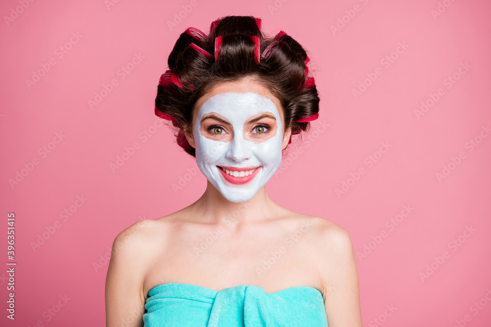 Wall mural Close-up portrait of lovely cheerful housewife wearing natural detox cleanser mask isolated on pink pastel color background