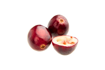 Halves and whole fresh red fall cranberries isolated on white