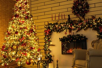 New Year tree with Christmas decorations lights and fireplace.