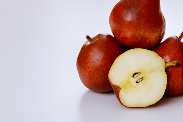 Red shiny pears isolated on white background.