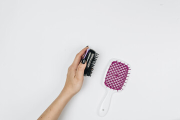 hair care products flatlay on white, hair comb