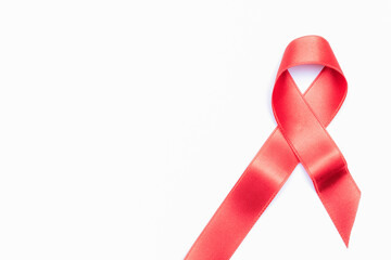 Awareness background. Red ribbon symbol in hiv world day isolated on white background. Awareness aids and cancer. Health, Medical sign. copy space.
