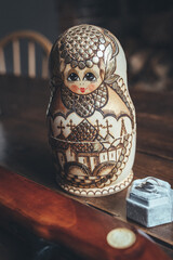 Russian doll on wooden table