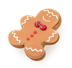 Laying Gingerbread man cookie isolated on white background.  Christmas gingerbread pastry close up. .