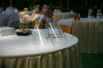 wedding table setting with two face shield in the wedding ceremony