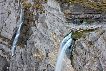People rappelling 'Salto del Nervion' waterfall. Burg  Alava, Bizkaia.