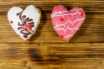 Heart shaped cookies on wooden table. Top view, copy space. Dessert for valentine day