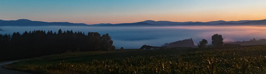 Fototapeta premium Beautiful hazy sunrise at Kirchberg im Wald, Bavarian forest, Bavaria, Germany