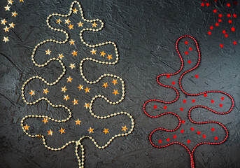 Gold and red decorations in the form of a Christmas tree on a black background.