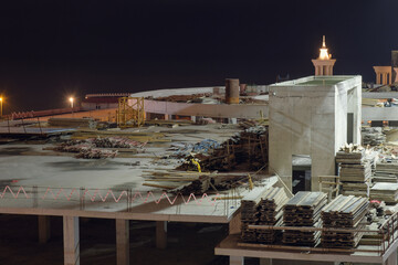 View of an empty illuminated construction site at night