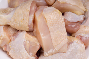 Raw chicken tender curry cut with skin