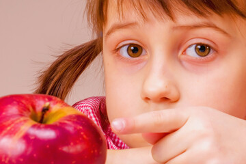 Portrait of young beautiful girl chooses healthy food.