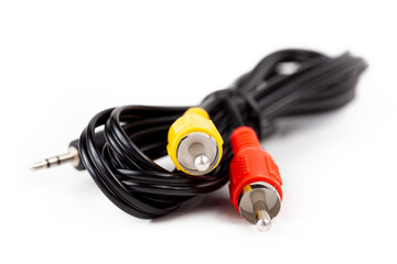 RCA composite video cable curled up jack to yellow and red chinch short cord, isolated on white, background, cut out. Simple retro obsolete video display cabling, old analog technology concept