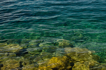 Background: surface of emerald sea