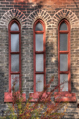 Fototapeta na wymiar Church wall and tall windows