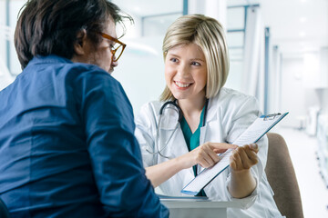 Doctor and patient sitting in doctor's office for an examination