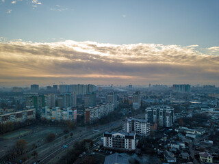 Aerial drone flight over Kiev, haze over the city. Autumn morning.