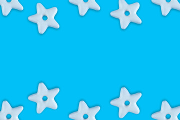 Christmas traditional cookies bakery star pattern on blue background.Concept banner frame border background for Christmas and New Year.