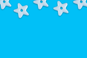 Christmas traditional cookies bakery star pattern on blue background.Concept banner frame border background for Christmas and New Year.