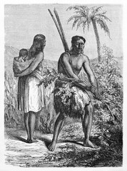 Lengua indians family, female carrying child on back and man picking up branch, Gran Chaco region, Paraguay. Ancient grey tone etching style art by Bertall and Hadamard, Le Tour du Monde, 1861