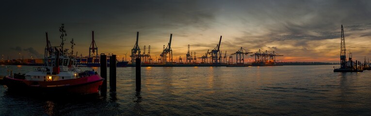 Large panorama of the Hamburg harbor in the early evening in autumn