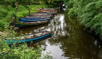 Boats docked at canal , Lakes of Killarney, Killarney National Park, County Kerry, Ireland near Castle Ross